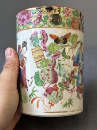 A pair of Chinese reticulated Canton famille rose brush pots, 19th C.