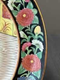 A pair of Chinese monogrammed Canton famille rose plates with black-glazed rims, 19th C.