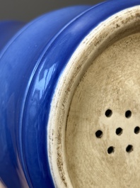 A pair of Chinese monochrome blue-glazed wall pocket vases, 19/20th C.