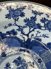 A Chinese blue and white dish with landscape and floral panels, Kangxi