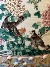 A Chinese famille rose garden seat with birds among blossoming branches, 19th C.