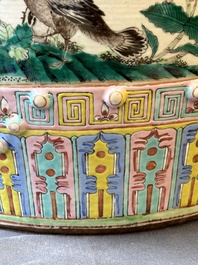 A Chinese famille rose garden seat with birds among blossoming branches, 19th C.