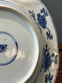 Four Chinese blue and white lobed 'phoenix and monkey' plates, flower mark, Kangxi