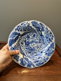 Four Chinese blue and white lobed 'phoenix and monkey' plates, flower mark, Kangxi