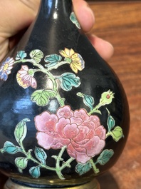 A pair of Chinese black-ground famille rose vases with gilt bronze mounts, Yongzheng