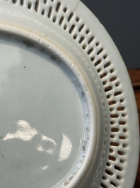 An oval Chinese Canton famille rose dish with a reticulated border, 19th C.
