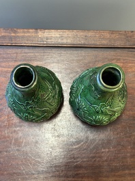 Two Chinese monochrome green-glazed stoneware 'dragon' vases and a kendi, Fujian kiln, late Ming