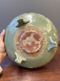 A Chinese Longquan celadon tripod censer on wooden stand, Yuan/Ming