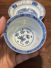 A Chinese blue and white reticulated double-walled cup and saucer, Kangxi