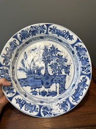 A Chinese blue and white 'antiquities' dish, Kangxi