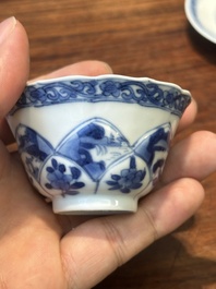 Four Chinese blue and white saucers and an 'erotic' cup, Kangxi