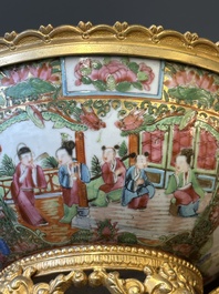 A Chinese Canton famille rose reticulated basket on stand and a bowl with gilt bronze mounts, 19th C.