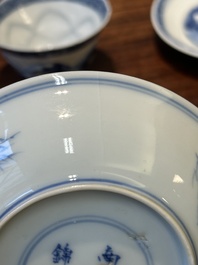 Four Chinese blue and white saucers and an 'erotic' cup, Kangxi