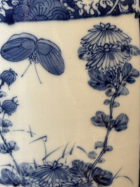A pair of Chinese blue and white jars and a vase, Kangxi mark, 19th C.
