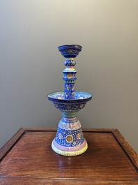 A large Chinese Canton enamel blue-ground 'shou' candlestick, Qianlong/Jiaqing