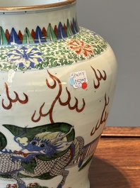 A Chinese wucai 'qilin' baluster vase, 19th C.