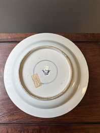 A Chinese blue and white dish with landscape and floral panels, Kangxi