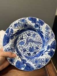 Four Chinese blue and white lobed 'phoenix and monkey' plates, flower mark, Kangxi