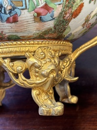 A Chinese Canton famille rose reticulated basket on stand and a bowl with gilt bronze mounts, 19th C.
