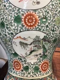 A pair of Chinese famille verte 'bird and flower' vases and covers, Kangxi mark, 19th C.