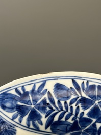 Four Chinese blue and white lobed 'phoenix and monkey' plates, flower mark, Kangxi