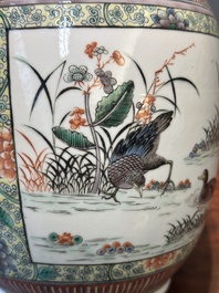 A Chinese famille verte covered vase and a bottle vase, 19th C.
