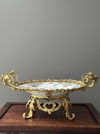A Chinese famille rose 'flower basket' dish with gilt bronze mount, Yongzheng