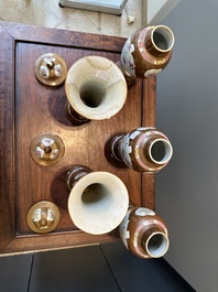 A Chinese capucin-brown-ground famille rose garniture of five vases with floral design, Qianlong