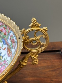 A Chinese Canton famille rose reticulated basket on stand and a bowl with gilt bronze mounts, 19th C.