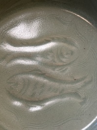 A Chinese Longquan celadon dish with floral anhua design, Ming