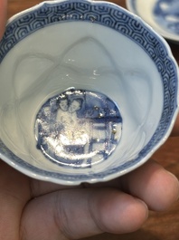 Four Chinese blue and white saucers and an 'erotic' cup, Kangxi