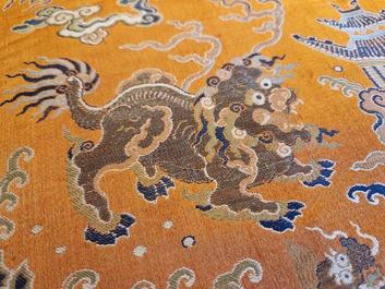 A Chinese embroidered silk 'kesi' cloth with Buddhist lions and phoenixes, 19th C.