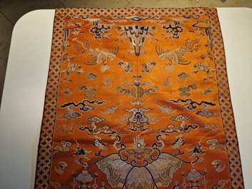 A Chinese embroidered silk 'kesi' cloth with Buddhist lions and phoenixes, 19th C.