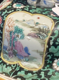 A pair of Chinese famille rose black-ground jars and covers with mountainous landscape design, Yongzheng