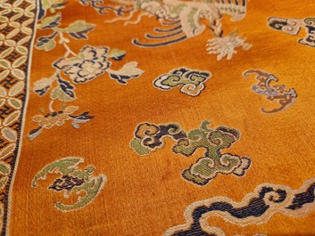 A Chinese embroidered silk 'kesi' cloth with Buddhist lions and phoenixes, 19th C.