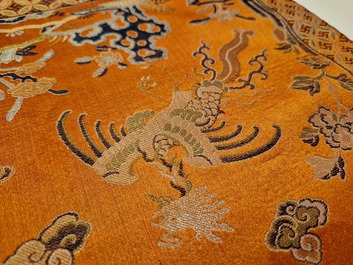 A Chinese embroidered silk 'kesi' cloth with Buddhist lions and phoenixes, 19th C.