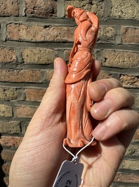 A Chinese red coral figure of a lady holding a fan and a phoenix, 19/20th C.