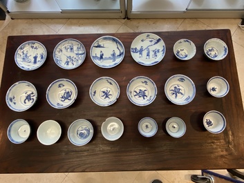 A collection of 15 Chinese blue and white cups and 19 saucers, Kangxi/Yongzheng