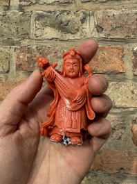 A set of seven Chinese red coral figures on wooden stand, 19/20th C.
