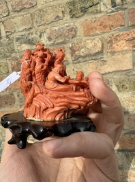 A Chinese red coral 'Eight Immortals' group on wooden stand, 19/20th C.
