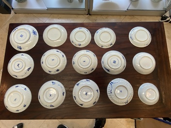 A collection of 15 Chinese blue and white cups and 19 saucers, Kangxi/Yongzheng