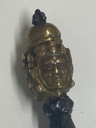 Four Tibetan bronze and wooden phurbas, a 'kapala' or skull-bowl, a pair of brass tingsha and two silver ornaments,  19th C.