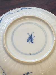 A collection of 15 Chinese blue and white cups and 19 saucers, Kangxi/Yongzheng
