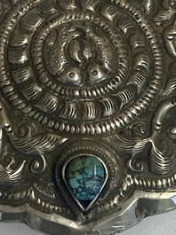 Four Tibetan bronze and wooden phurbas, a 'kapala' or skull-bowl, a pair of brass tingsha and two silver ornaments,  19th C.