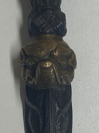 Four Tibetan bronze and wooden phurbas, a 'kapala' or skull-bowl, a pair of brass tingsha and two silver ornaments,  19th C.