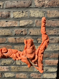 A Chinese red coral 'Eight Immortals' group on wooden stand, 19/20th C.