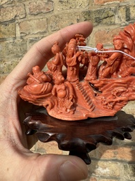 A Chinese red coral 'Eight Immortals' group on wooden stand, 19/20th C.