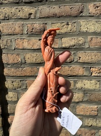 A Chinese red coral figure of a lady holding a fan and a phoenix, 19/20th C.