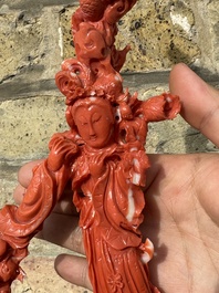 A large Chinese red coral group of female deities among clouds on wooden stand, 19/20th C.