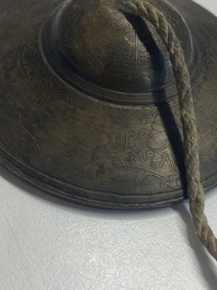 Four Tibetan bronze and wooden phurbas, a 'kapala' or skull-bowl, a pair of brass tingsha and two silver ornaments,  19th C.